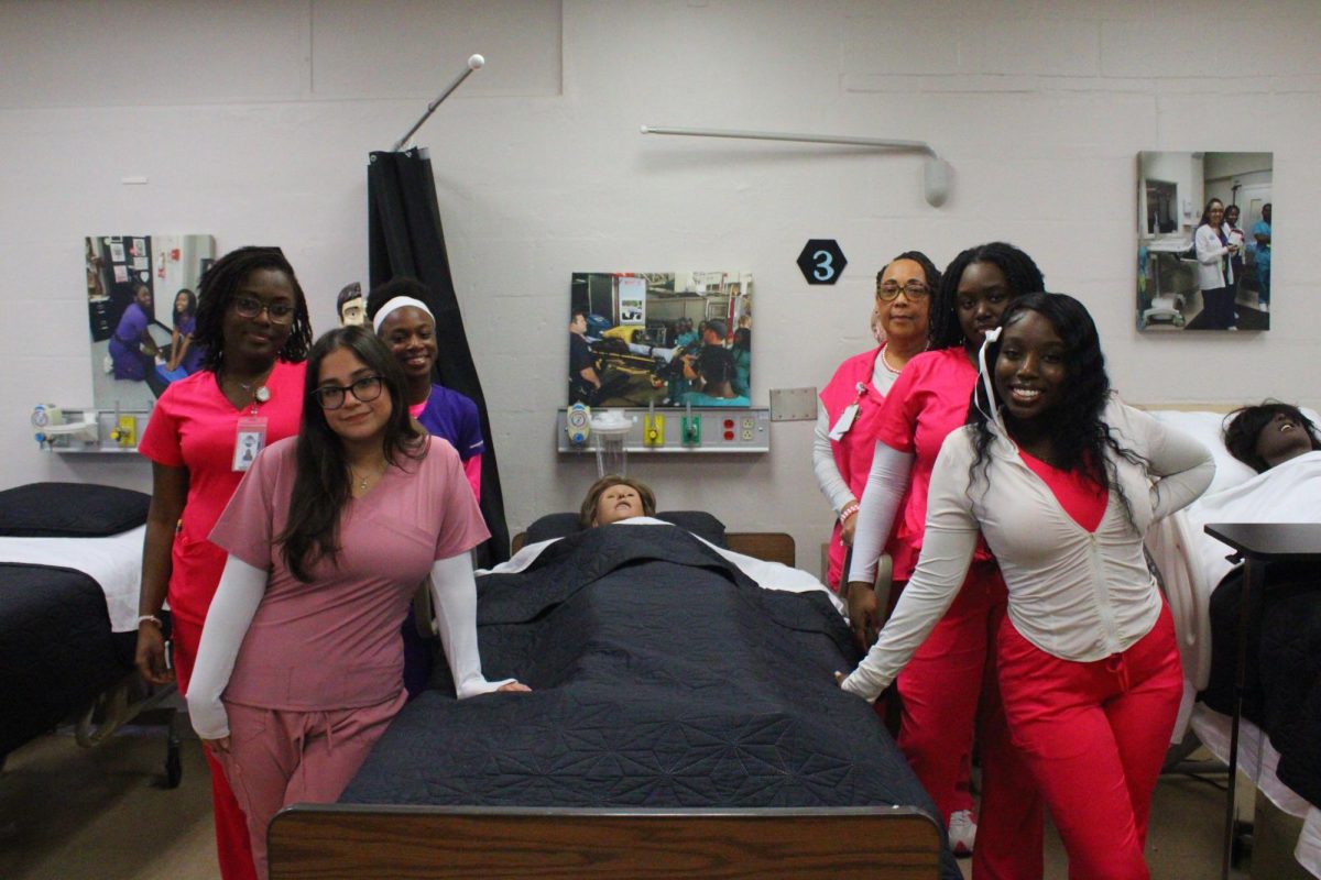 HOPE  & HEALING: Nurse Chavers the director of the medical academy and the Senior Nursing students wore pink in support of breast cancer awareness.