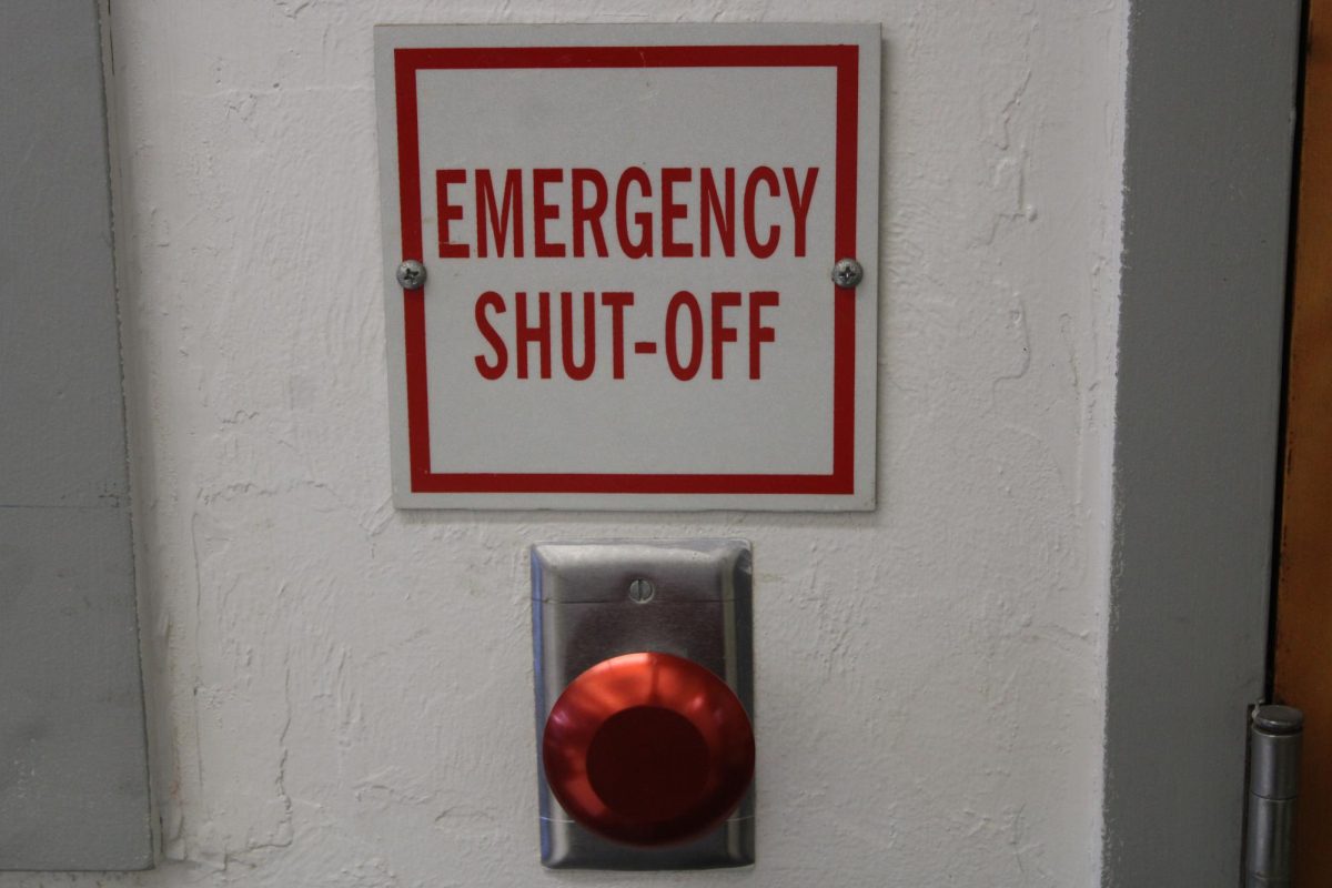 MAYDAY: This emergency button has a place in many building 7 classes like this, and several of them can be found in the room.