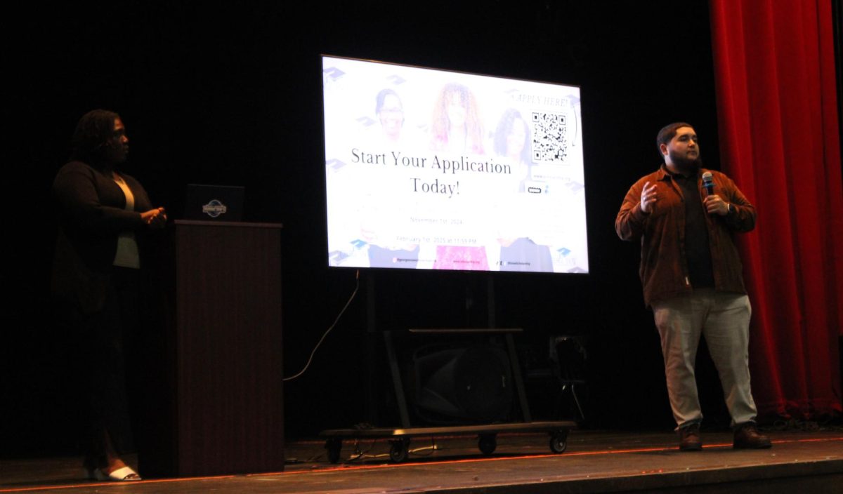 CASH IN ON COLLEGE: Austin Havass and Bithia Meus from the George Snow Scholarship Fund visited Inlet Grove to inform students about applying for the scholarship. They discussed eligibility requirements, application deadlines, and the application process.