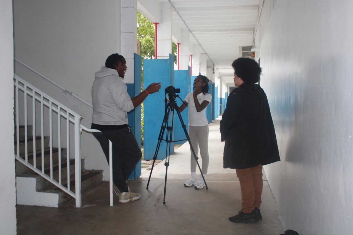 CAREFUL PLANNING: (left to right) Nicholas Royal, Garionna Lowe,  and Jordan Ottenwalder discuss ideas on how they will  execute the perfect scene. 