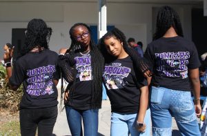 NEW LOOK: Brooklyn Rolle and Tahira Morris showcase the front design of the Junior Class T-shirts, while Svetlana Gilot and Kaylee Mason display the back.