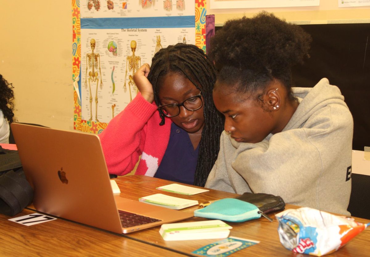 TWO-IN-ONE: (left to right) Seniors Carlie Pacius and Dynasty Desir work together to study vocabulary words for an upcoming exam. 
