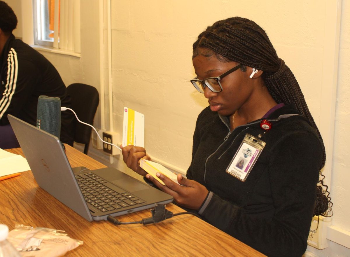 NO TIME TO WASTE:  Vitanya St. George, a Senior in the LPN Academy, studies alone using index cards to help her study a difficult lesson.  