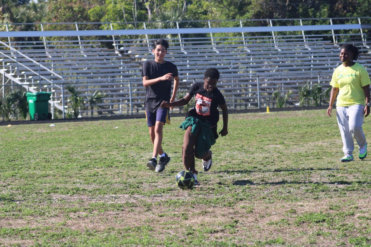 KICK IT IN: During 4th period, Coach Donavan class played soccer on the field.