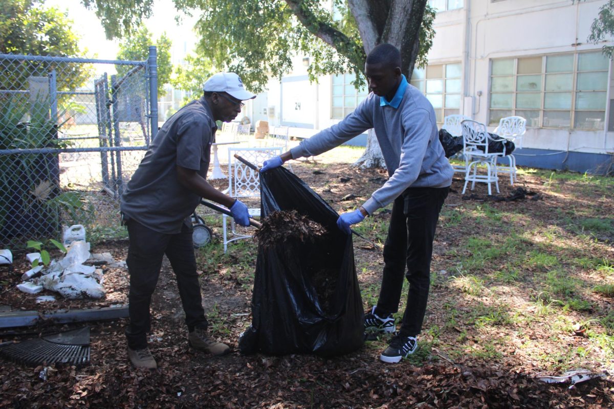 HANDS IN THE GARDEN: During 2nd period, Mr. Burt's Marine Biology class lends a hand to keep our garden strong. 
