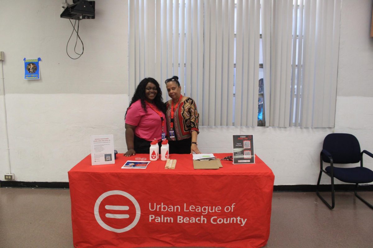 BETTERING THE COMMUNITY: Members of the Urban League of Palm Beach County came during lunch to promote various programs to students who were interested in how they could get involved around the city.