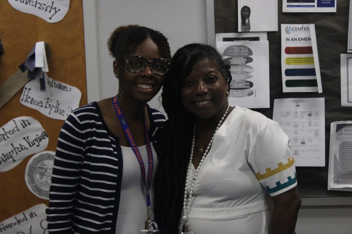 WELCOMING SMILE: Ms. Coleman and Ms. Bradford in their room located in the media center. 