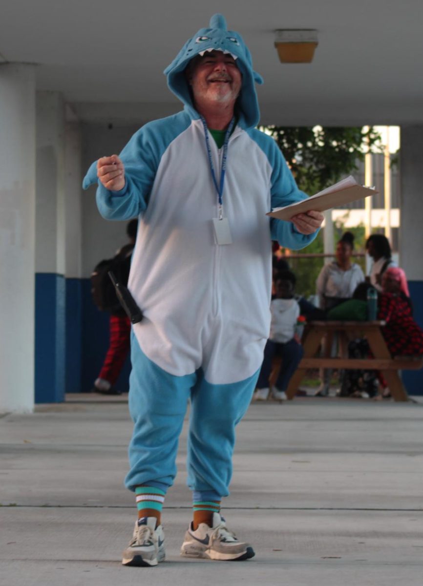PREDATOR: For the second day of spirit week, Mr. McDermott wore full body shark pajamas.