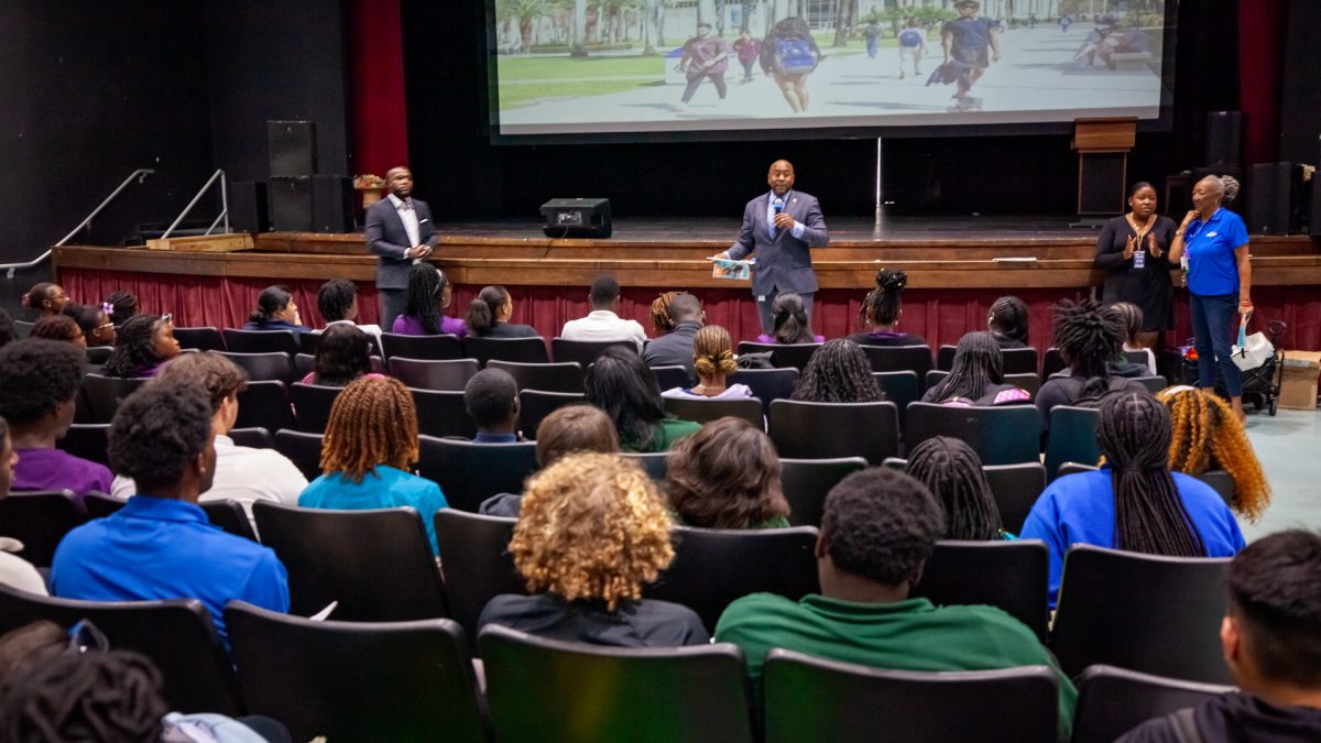 OPPORTUNITIES: Douglass Lawson, the mayor of Riviera Beach (center), and Jervonte Edmonds, the State Rep (left), held a senior meeting at the theatre on Sept.12., where they briefly discussed Riviera Beach’s 2025 Youth Council Interest Meeting, and brought FAU students who talked about scholarship opportunities.