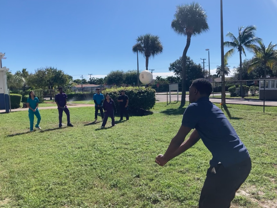 THE DIG: Dhelyan Harrington, a pre-law student, bumps the ball towards the opposing team as they play volleyball during lunch.