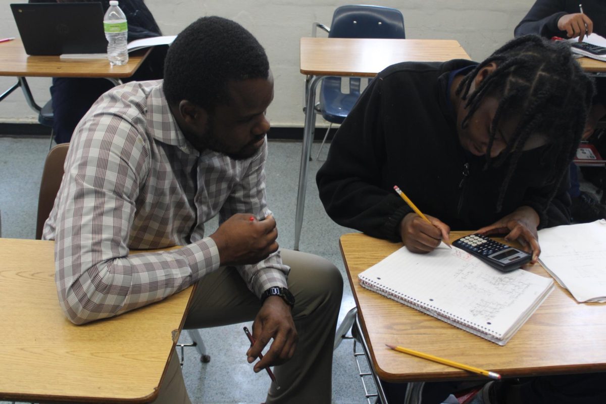 ONE-ON-ONE: Mr. Milce gives direct support to a student during class time.