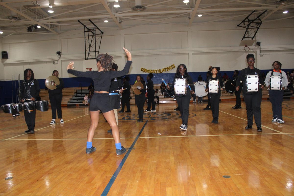 BEATS AND CHEERS!: The drumline takes over the stage