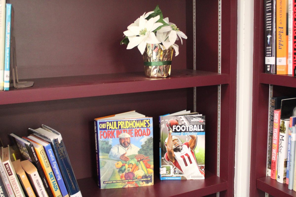 CENTER STAGE: A pair of books sits with a flower.