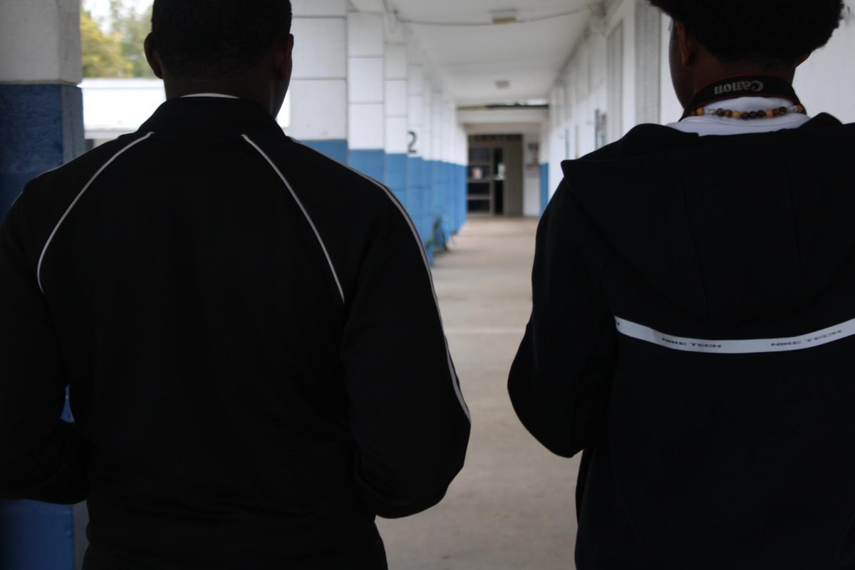 BROTHERHOOD: Two friends walk through the halls.