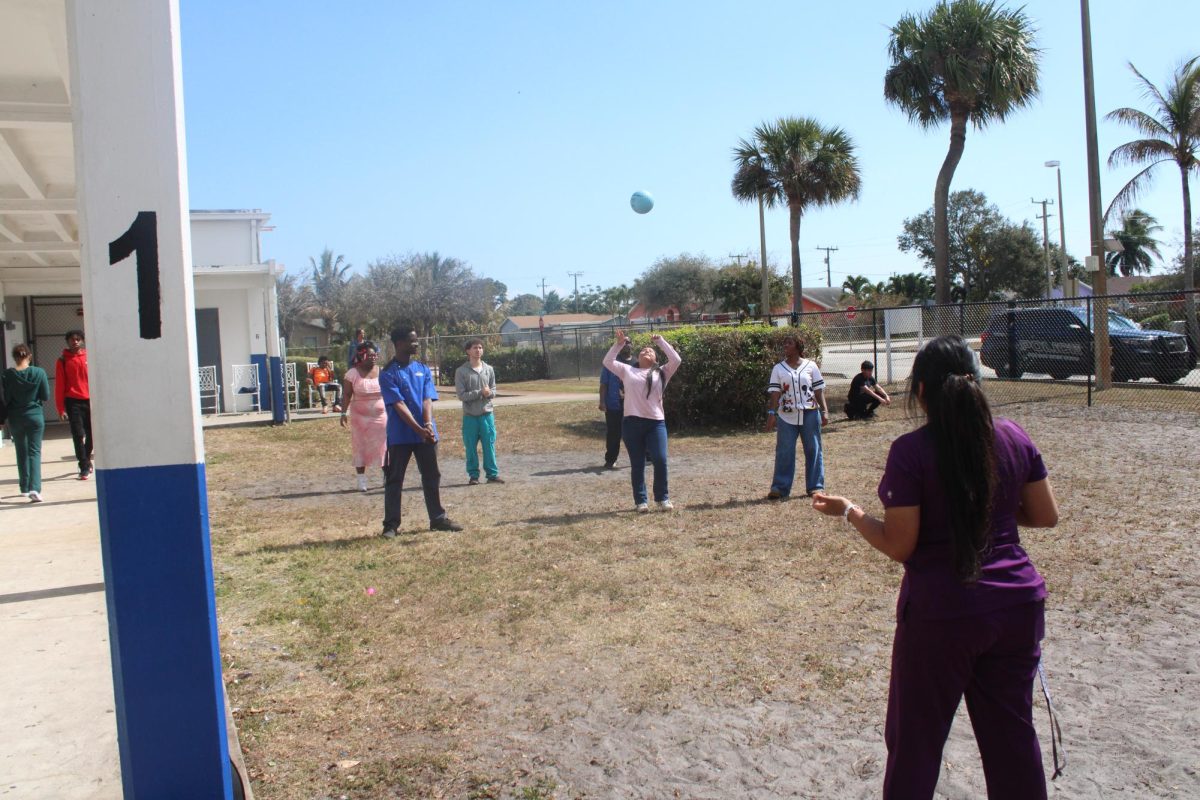 PREVAIL: Despite the dust and sun, the students continue to play and have fun.