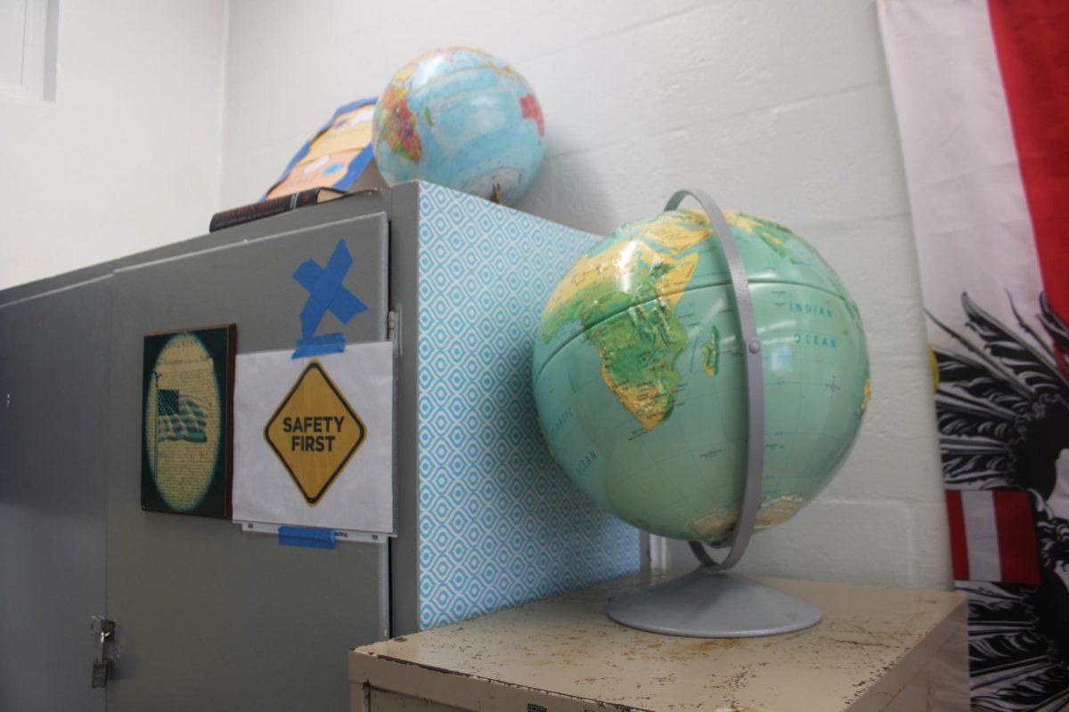 TWO EARTHS: In addition to two maps, this teacher also has two globes in her class. Hmm, they must be really into geography.