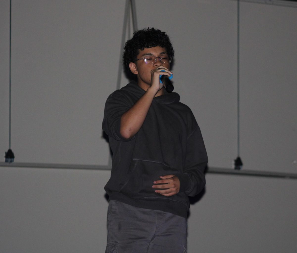ON STAGE: Student performs on stage during a school talent show at Inlet Grove. The high school event featured six student contestants.