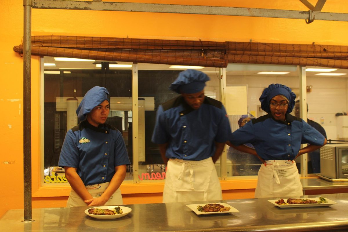 SERVE UP: Culinary students Jefry, Carstan, and Angel were requested by Chef Hall to make a dish which included steak, potatoes and asparagus. 
