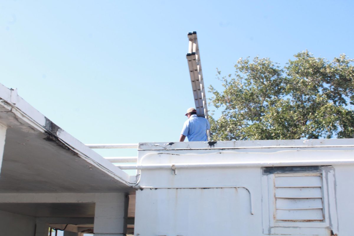 RENEWING RENOVATION: Workers came over to fix the roof in building 5.