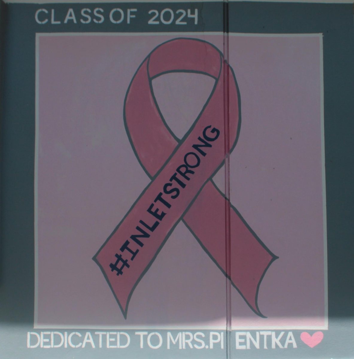 PINK FOR PIENTKA: The Senior Class of 2024 painted a Breast Cancer ribbon in remembrance of Ms. Pientka, who is a breast cancer survivor and a beloved person to students, staff, and her family.